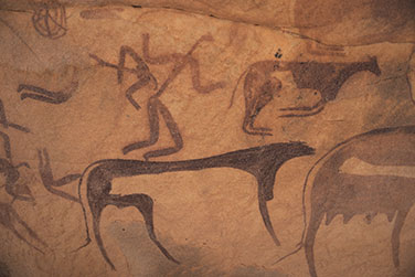 Felszeichnungen von Personen und Rindern